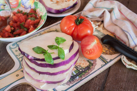 Cooking eggplants with tomatoes の写真素材