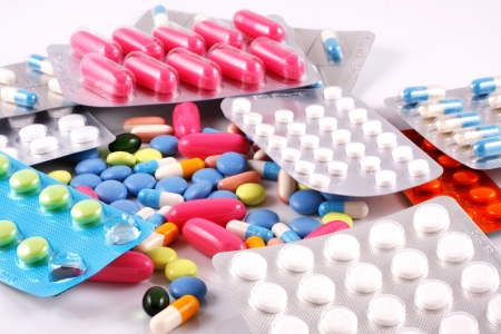Pills of many shapes and colors grouped together Pills of many shapes and colors grouped together