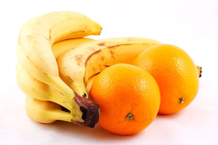 Bunch of bananas and oranges composition isolated on white backgroundの写真素材