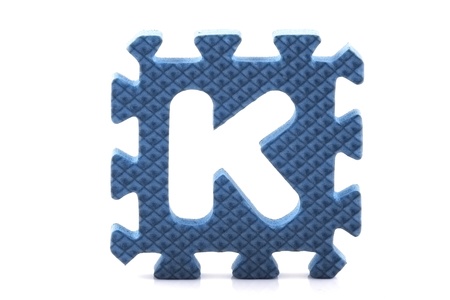 Alphabet puzzle pieces on white backgroundの写真素材