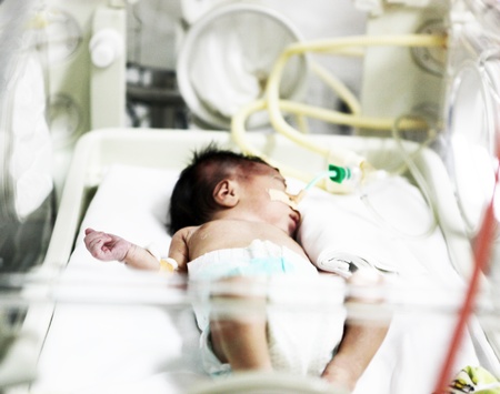 Newborn baby inside incubatorのeditorial素材