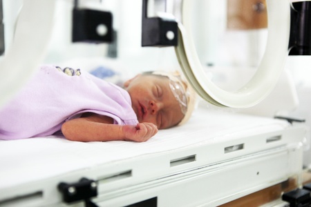 Newborn baby inside incubatorのeditorial素材
