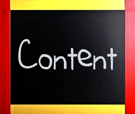 The word "Content" handwritten with white chalk on a blackboardの写真素材