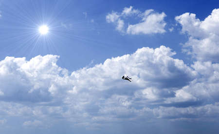 Blue sky with sun and beautiful clouds.