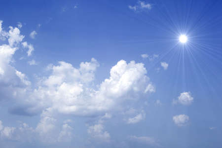 Blue sky with sun and beautiful clouds.