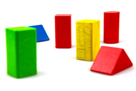 Wooden building blocks isolated on white background.