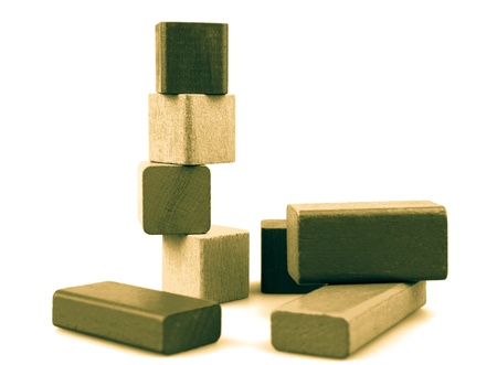 Wooden building blocks isolated on white background.