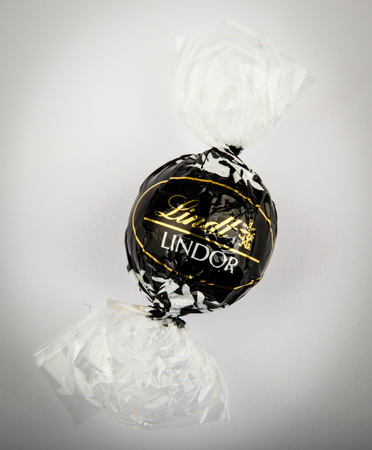 AYTOS, BULGARIA - APRIL 02, 2014: Milk Chocolate LINDOR truffle. Lindt & SprÃ¼ngli is recognized as a leader in the market for premium quality chocolate.のeditorial素材