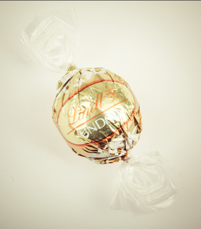 AYTOS, BULGARIA - APRIL 02, 2014: Milk Chocolate LINDOR truffle. Lindt & SprÃ¼ngli is recognized as a leader in the market for premium quality chocolate.のeditorial素材