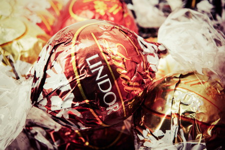 AYTOS, BULGARIA - APRIL 02, 2014: Milk Chocolate LINDOR truffle. Lindt & SprÃ¼ngli is recognized as a leader in the market for premium quality chocolate.のeditorial素材