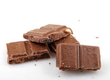 AYTOS, BULGARIA - MAY 05, 2014: Milka milk chocolate with Alpine milk and raisins and hazelnuts. Milka is a traditional brand of chocolate confection, since October 2012 manufactured by MondelÄz International.のeditorial素材