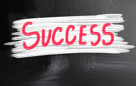 success handwritten with chalk on a blackboardの写真素材