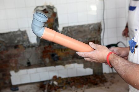 Plumber working on pipes.の写真素材