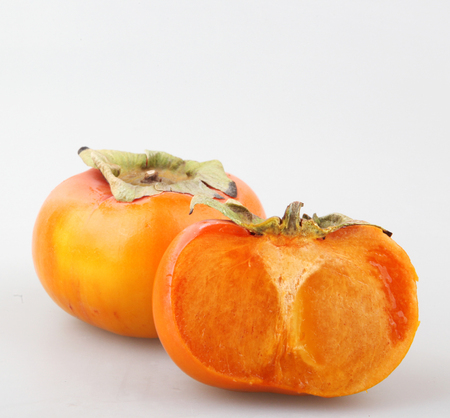 Fresh ripe persimmonsの写真素材