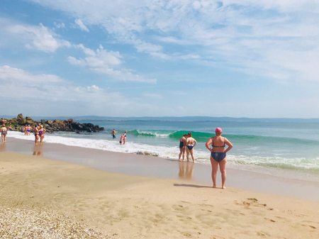 Pomorie, Bulgaria - May 30, 2018: View of the people spending time on the beach.のeditorial素材