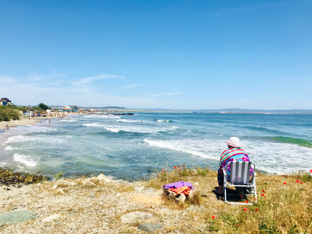 Pomorie, Bulgaria - May 30, 2018: View of the people spending time on the beach.のeditorial素材