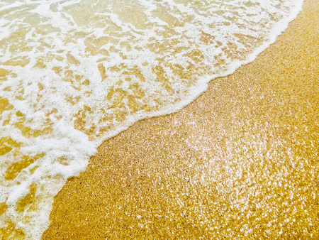 Close Up Of Surf On Sandy Beachの写真素材