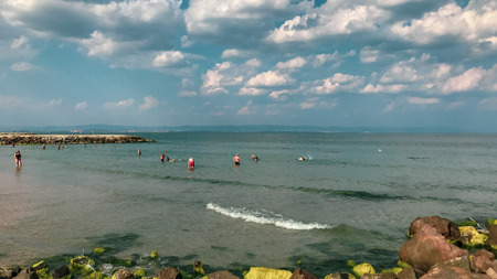 Pomorie, Bulgaria - September 08, 2018: People relaxing on the beach.