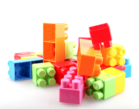 Plastic colorful toy blocks on white backgroundの写真素材