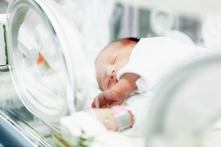 SLIVEN, BULGARIA - January 21, 2012: Newborn baby in hospital.のeditorial素材