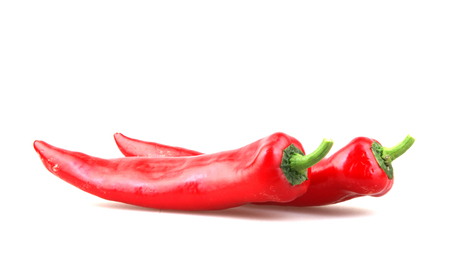 Close-Up Of Red Chili Pepper Against White Backgroundの写真素材