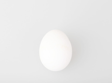 Close-Up Of Egg Over White