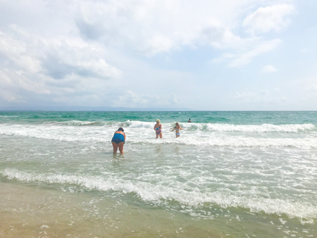 Pomorie, Bulgaria - June 12, 2019: People Relaxing On The Beach.のeditorial素材