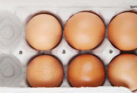 Close-Up Of Brown Eggs In Cartonの写真素材
