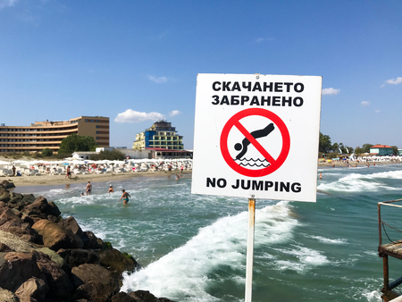 Pomorie, Bulgaria - September 01, 2019: Sign No Jumping On The Beach By The Sea.のeditorial素材