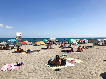 Pomorie, Bulgaria - September 06, 2019: People Relaxing On The Beach.のeditorial素材