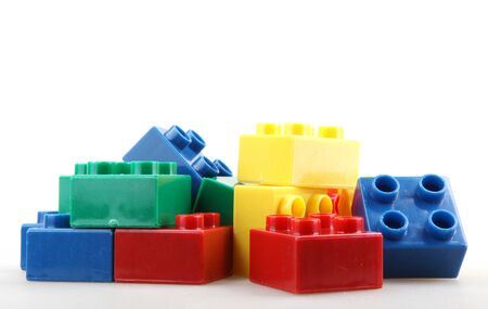 Close-Up Of Plastic Building Blocks Against White Backgroundの写真素材