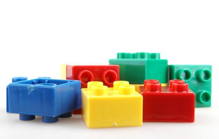 Close-Up Of Plastic Building Blocks Against White Backgroundの写真素材