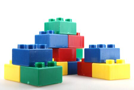 Close-Up Of Plastic Building Blocks Against White Backgroundの写真素材