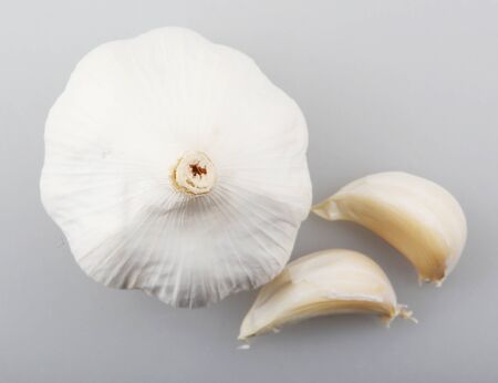 Close-Up Of Garlic Clove Against White Background