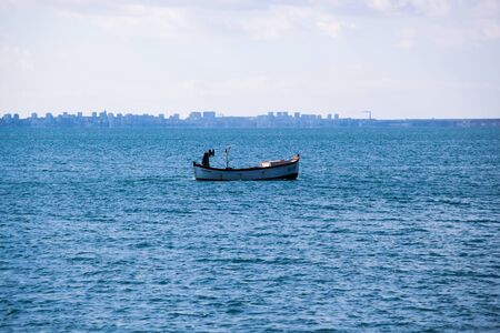 Pomorie, Bulgaria - February 07, 2020: Fishing Boat Far In The Sea.