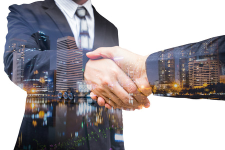 The double exposure handshake businees and cityの写真素材