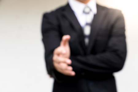 The Blurry business man a handshake ready to seal a deal.の写真素材