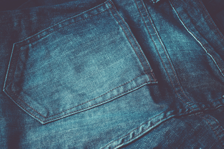 Close up of blue pocket  jeans , Style Blue Jeans texture on wood backgroundの写真素材