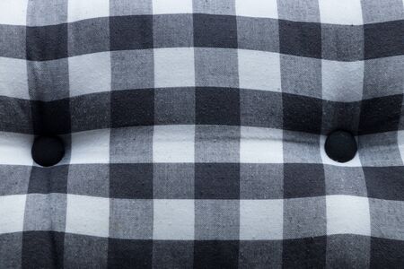 Abstract geometric  white and black style fabric with button texture from bed.の写真素材