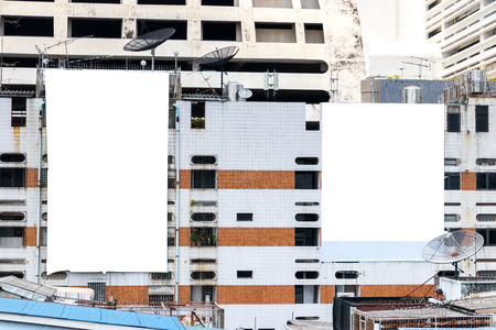 Blank billboard on building, empty sign on apartment mockup.の写真素材