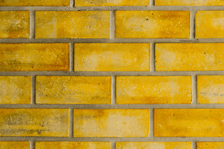 Large Yellow Brown Old Shabby Brick Wall Square Background Texture.の写真素材