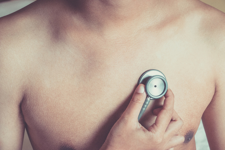 Doctor examining patient with stethoscope in hospital. Medical examination, stethoscope, medicine and therapy.の写真素材