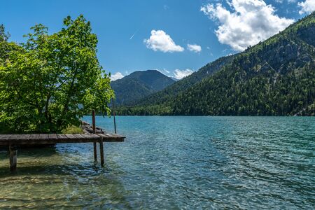 view on lake plansee and tauern in austrian alps, tyrol, austriaの写真素材