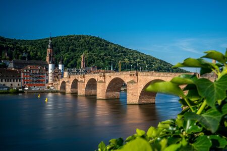 view on karl theodor (old) bridge crossing the neckar river, germanyの写真素材