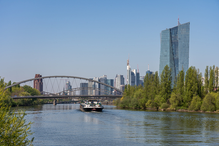 view on main river, bridge and frankfurt skyline from littoral of main river, frankfurt, hesse, germanyのeditorial素材