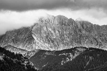 mountain panorama of the karwendel mountains with clouds in bavaria, germanyの写真素材