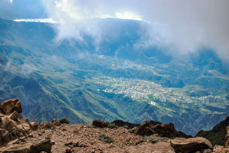 cirque de cilaos at sunrise viewed from a trail to le maido mountain topの写真素材
