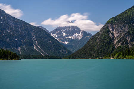 view on lake plansee and tauern in austrian alps, tyrol, austriaの写真素材