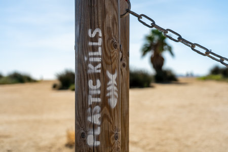 plastic kills fish writing on beach in southern franceの写真素材