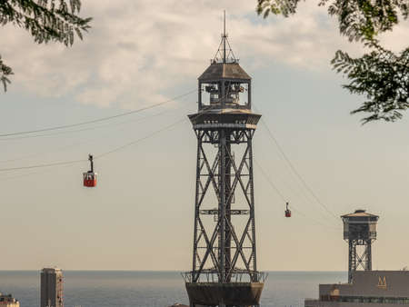 historic cable car, towers, harbor and city panorama of Barcelona, spainの写真素材